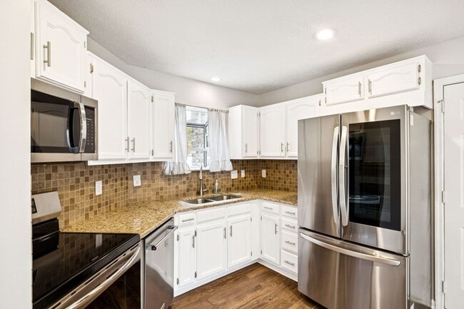 Building Photo - Welcome to this beautifully remodeled sing...