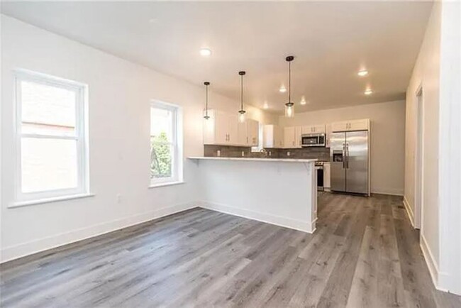 Building Photo - Brand New 4 Bedroom / 3.5 Bathroom Townhom...