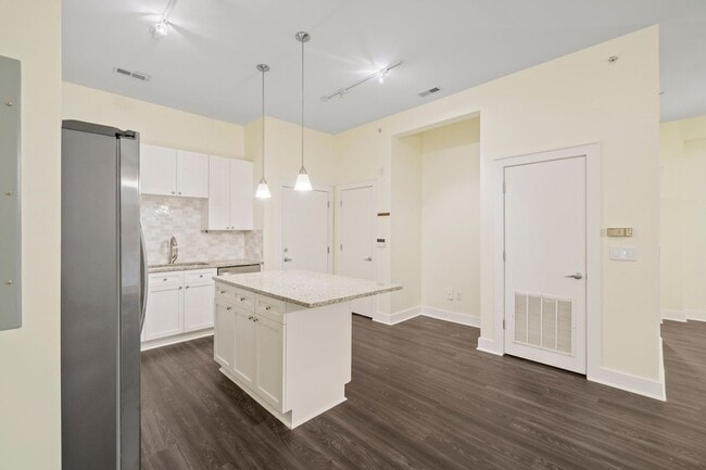 Building Photo - COMING SOON! Modern 1BR/1BA in First Ward – Walk to Parks, Dining & Entertainment