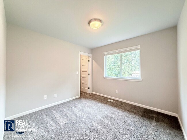 Building Photo - Easy JBLM Commute Like-New 4BR Home with 3-Car Garage & Bonus Office
