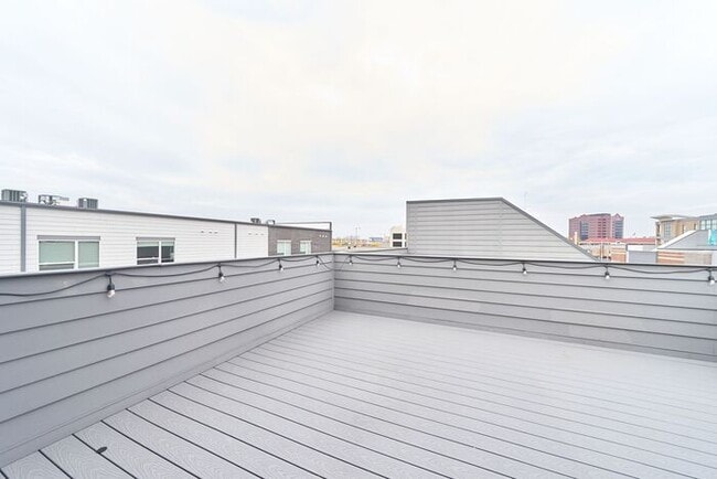 Building Photo - Like New Townhome With Your Own Rooftop Views of Downtown Indy!