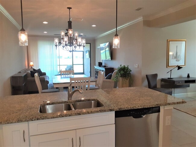 Building Photo - Seasonal/short term turnkey furnished Incredible 2/2 with den ground floor condo in resort Esplan...