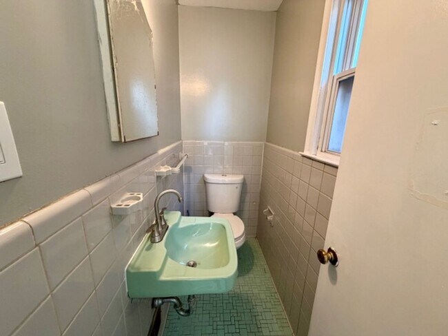 Building Photo - Three bedroom One and a half bath Brick Colonial home for lease