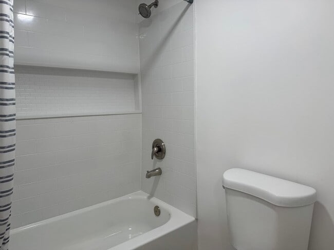 Building Photo - NOW OFFERING $400 OFF MOVE-IN COSTS Utilities Included – First Floor – In-Unit Washer/Dryer