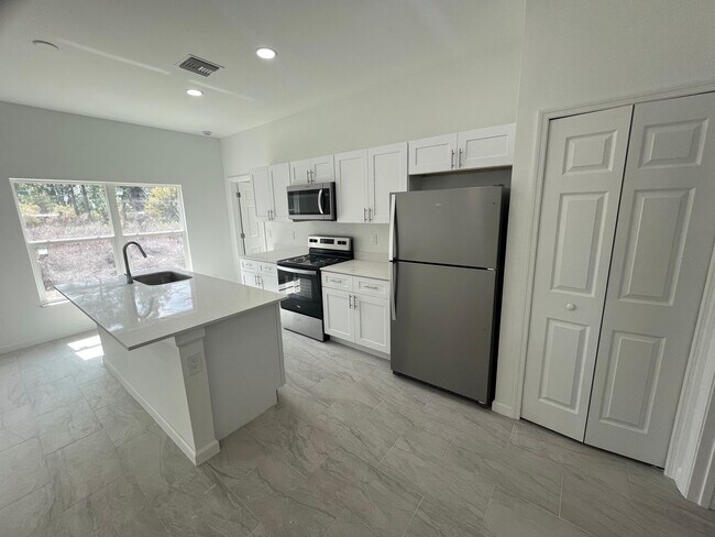 Building Photo - MODERN BRAND NEW 4BD/2BA RETREAT IN LEHIGH ACRES!