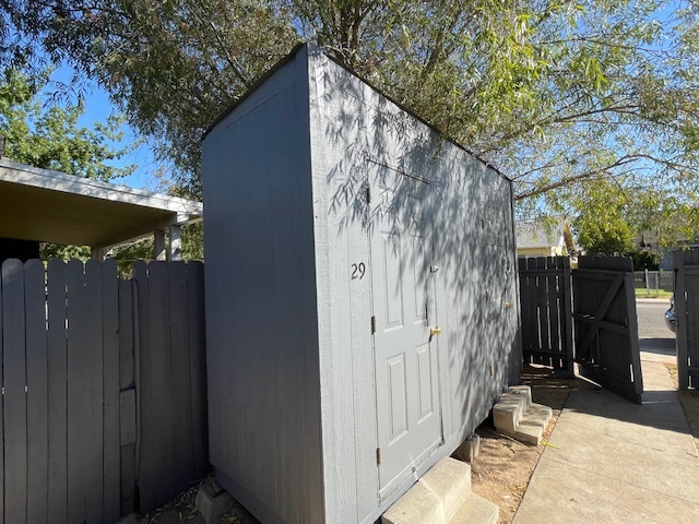 Lockable storage closet in fenced backyard for each duplex unit. - 3731 46th St