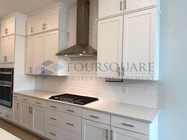 Building Photo - Elegant 4-Bed / 3.5-Bath Home with Main-Level Primary Suite, Quartz Kitchen & 3-Car Garage – In H...