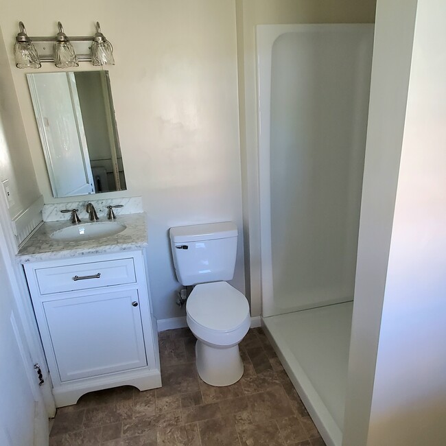 Hardwood vanity with marble top, walk-in shower - 252-3 Laurel St