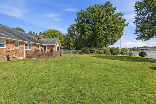 Building Photo - Stunning 4-Bedroom Waterfront Retreat with Modern Upgrades & Lake Living.