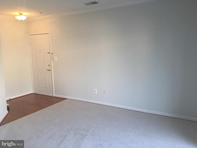 Building Photo - Welcome to this beautifully appointed two level upper condominium that combines modern style with...