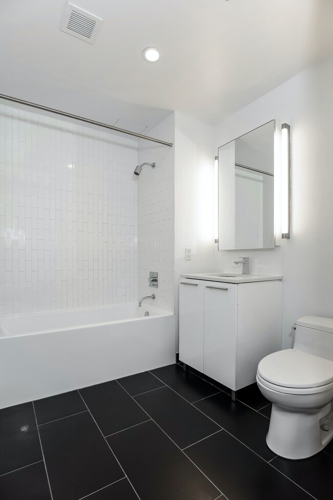 Building Photo - Corner studio with W/D in unit