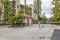 Building Photo - 1 br, 1 bath Condo - 5545 Canoga Ave, Wood...