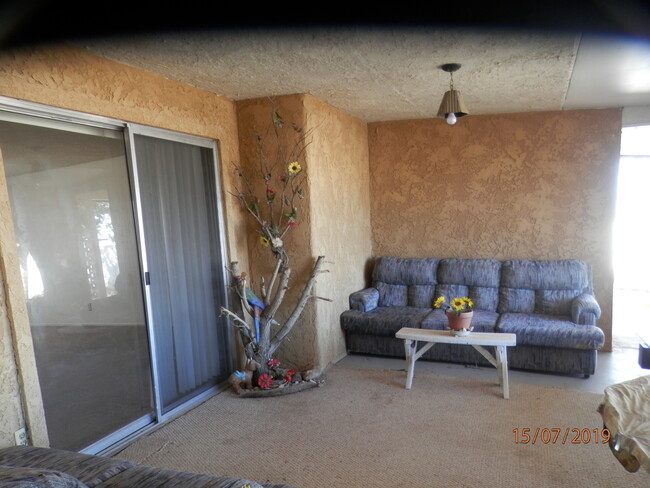 Enclosed patio has sofas, swing - 1050 Alta Ave