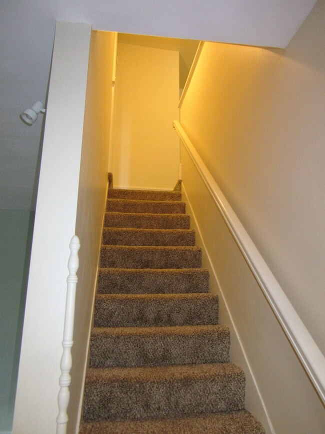 stairs to second floor bedrooms & bath - 105 W Vine St