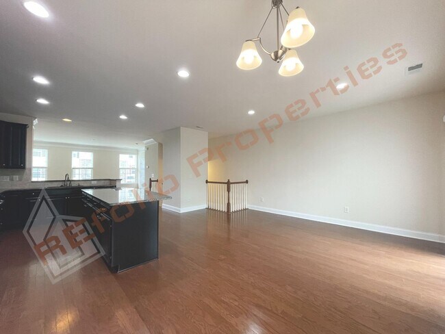 Building Photo - Beautiful 3 Story 3 Bedroom Townhouse with Huge 1st Floor Flex Space with Access to Patio + 2 Car...