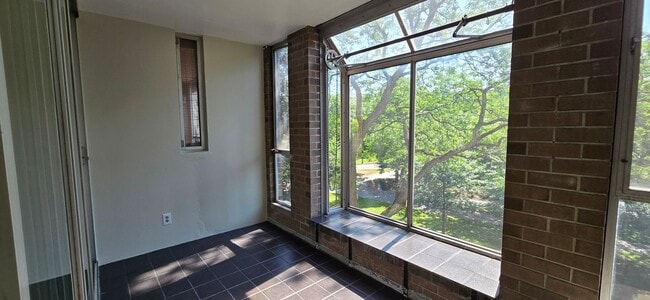 Building Photo - Short walk to Longwood! Steps to T! Large 1 bedroom w/enclosed porch! Garage parking incl.