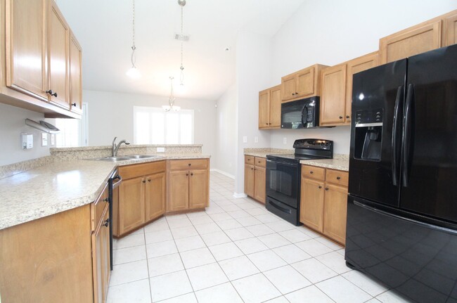 Building Photo - Updated 4BR Home Near NAS - Split Floor Pl...