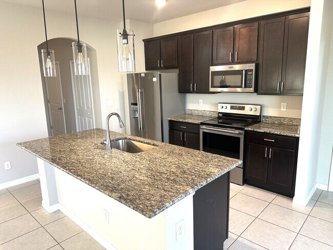 Building Photo - Available Mid April!! NW CAPE CORAL 3 BEDROOM 2 BATHROOM 2 CAR GARGAGE