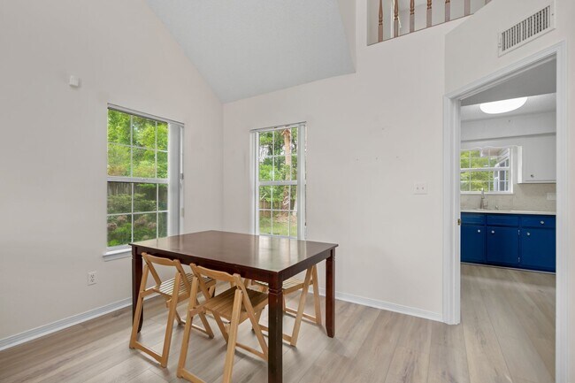 Building Photo - Spacious 3BR Retreat with Soaring Ceilings & Screened Porch