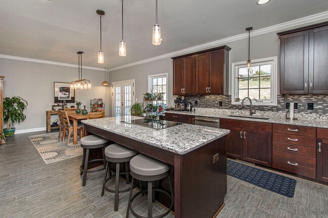 Building Photo - Spacious Home with Hot Tub, Fenced Yard an...