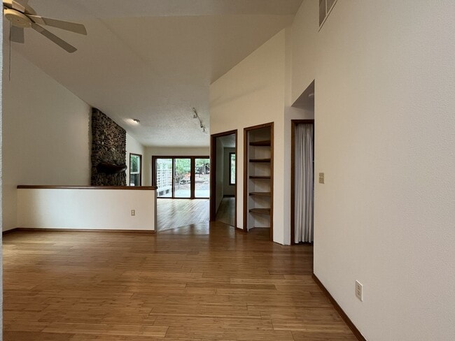 Building Photo - Spacious 3-Bedroom Home with Custom Stone Fireplace, Attached 2-Car Garage & Expansive Backyard i...