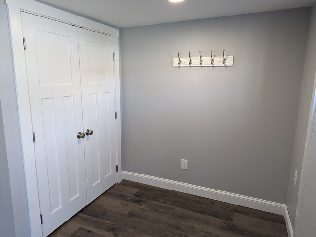 Double Closet at Entry with Coat Hooks - 2213 Western Ave