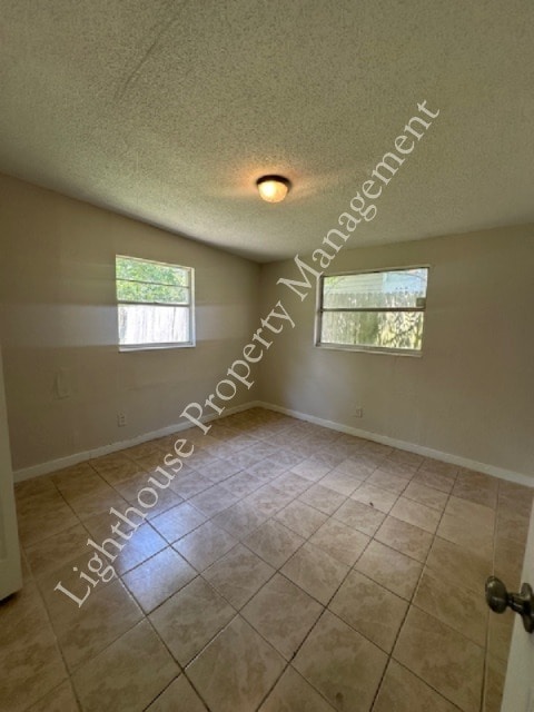 Building Photo - Bright 4 Bedroom Home With Tile Flooring Throughout