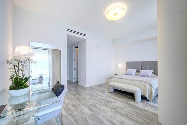 Building Photo - 10203 Collins Ave