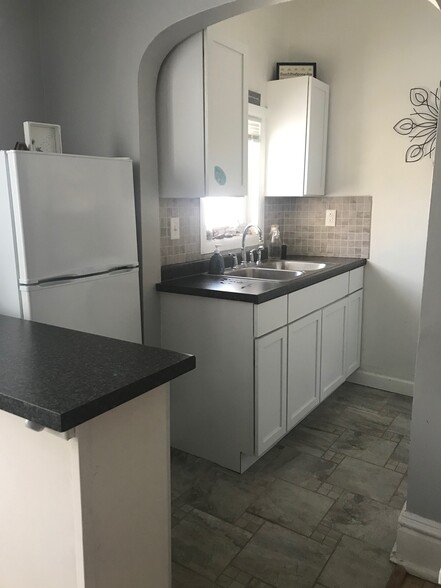 Tile floors, backsplashes, and new cabinets - 1018 E 3rd St