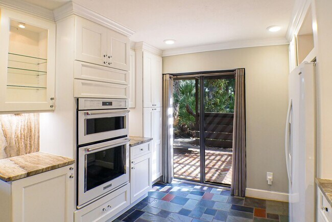 Building Photo - RARE ON MARKET , 2+den 2 1/2 bath overviewing a lake behind bell tower