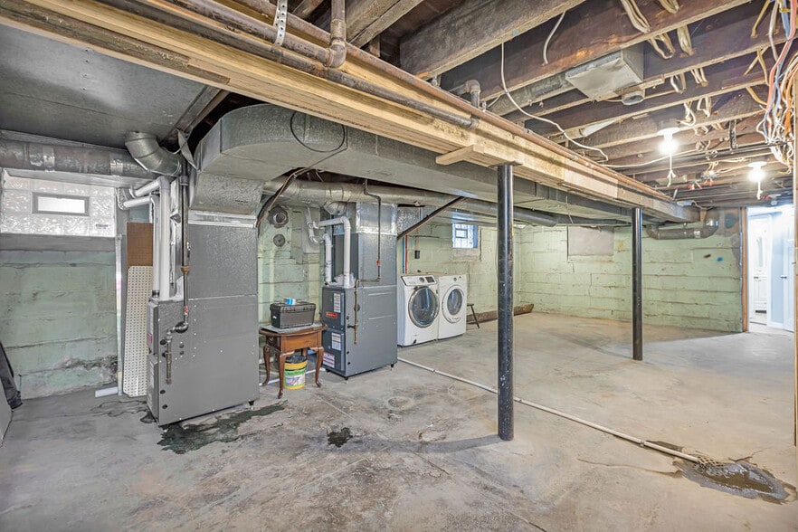 Clean basement with laundry and access to the third bedroom - 5125 Carthage Ave