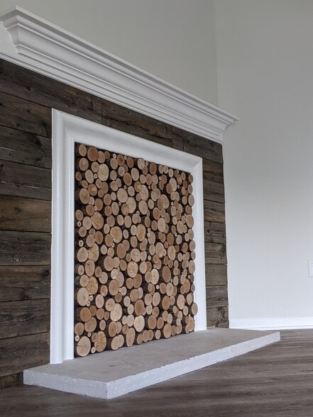 Close up of fireplace art. (The fireplace is non-functional.) - 1649 Summerhill Dr