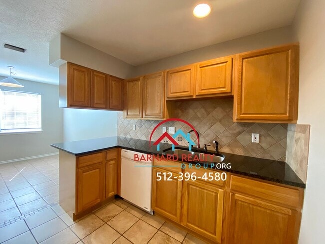 Building Photo - Available July 11: 3 bedroom, 2.5 Bath Duplex with Garage and Fenced Yard