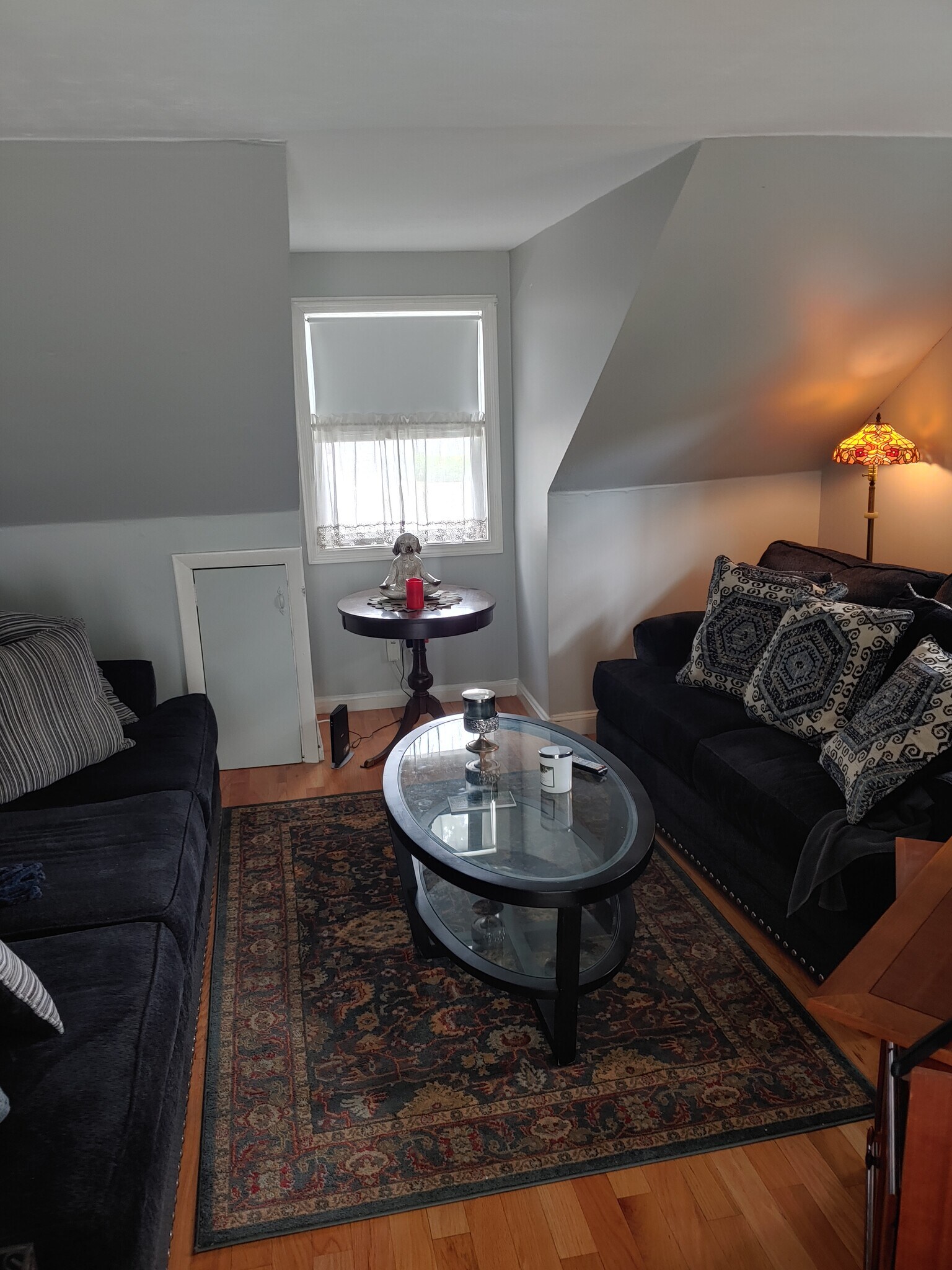 living room over 20 ft with slider and two windows opposite - 623 Old West Central St