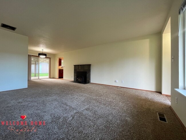 Building Photo - Beautiful Remodeled Rambler!!!  Come enjoy this HUGE backyard!!  NEW CARPET!!