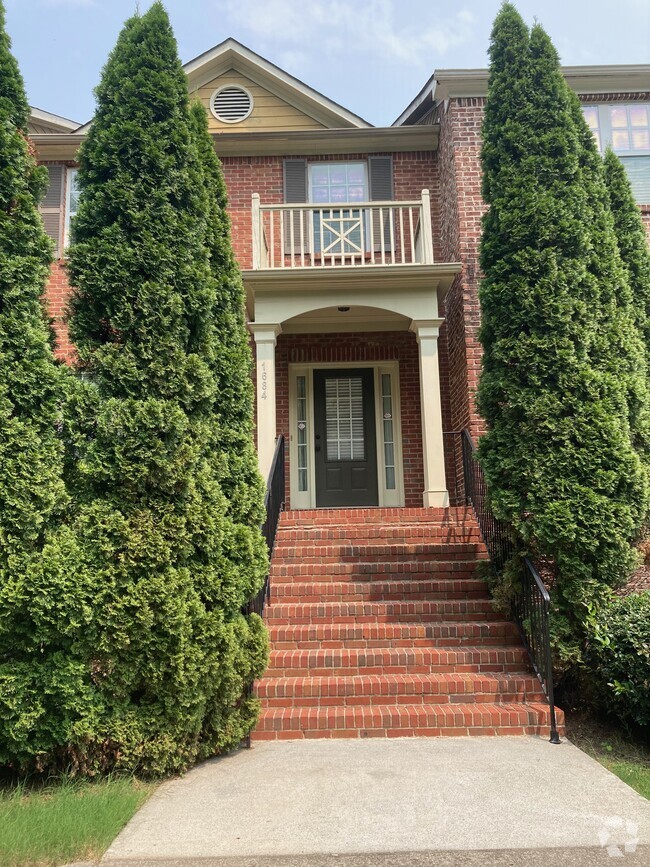 Front entrance, lots of greenery - 1684 Northgate Mill Dr