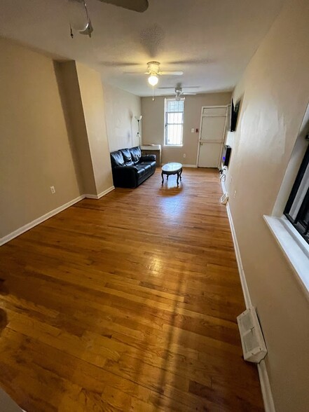 Apt 1 - Living Room w/ Fireplace and TV - 2148 N Carlisle St