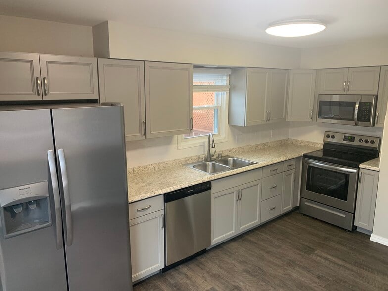 Kitchen with stainless steel appliances and cabinetry - 307 Valorie Ln
