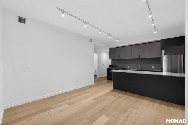 Building Photo - Act Fast: Luxury SoMa Corner Unit w/ EV Parking & Views