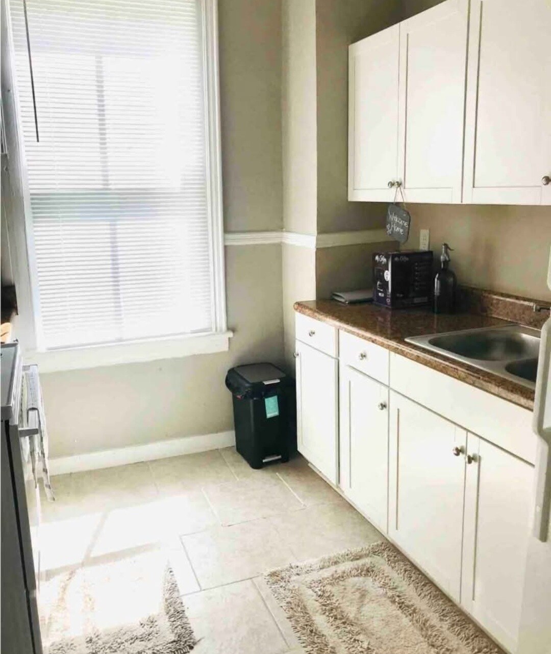 Full kitchen with electric stove, full refrigerator, and double sink. - 2234 Central Ave