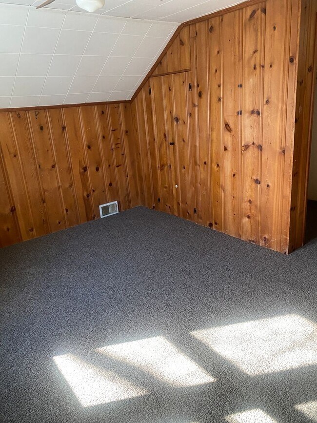 Building Photo - Three bedroom 1 bath bungalow with finished basement and 2 car garage