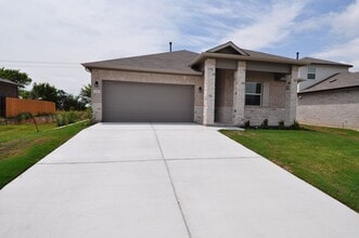 Building Photo - Home has an amazing entrance leading to the large family room open to the kitchen and dining room