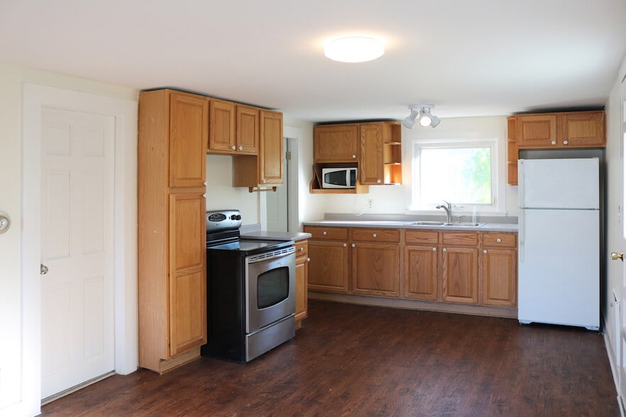 Open concept kitchen/living area with new flooring. - 34A Royal Ave