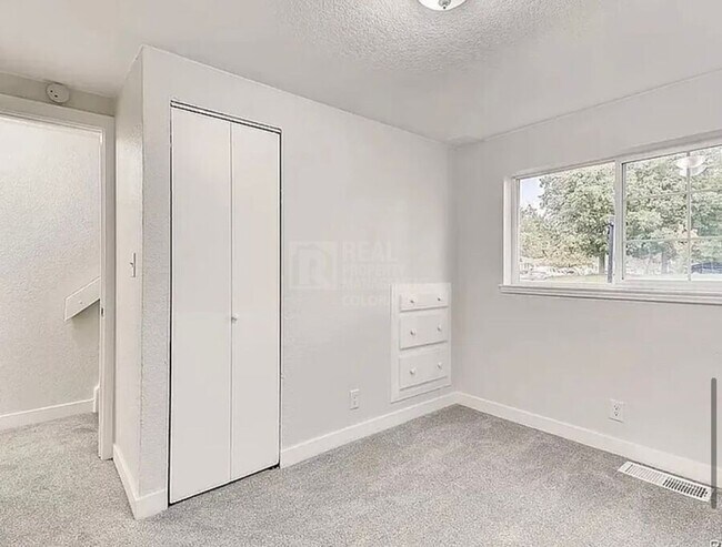 Building Photo - 7110 E 63rd Ave