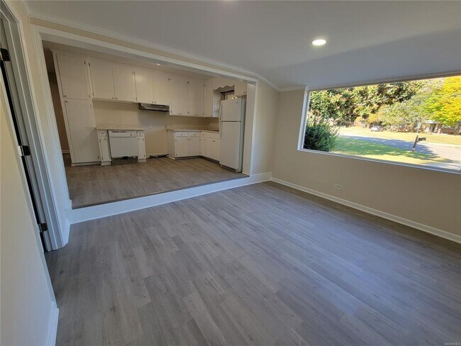 Building Photo - NEW Floors, Roof, Lights, Appliances, ect. NO CARPET