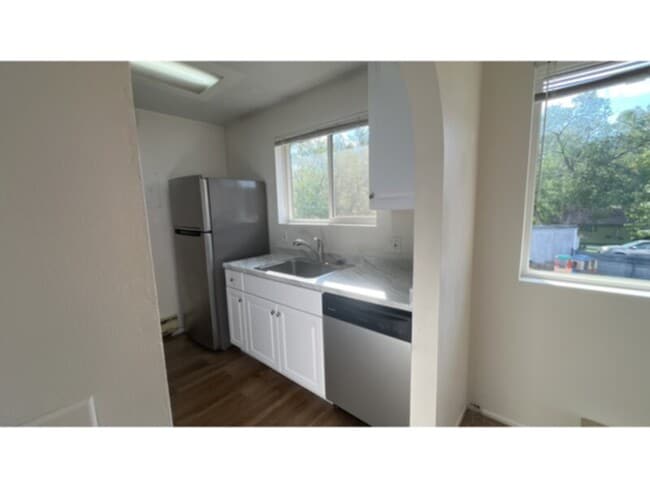 Building Photo - Tired of outdated rentals? This stunning two bedroom upper level duplex unit boasts a complete moder