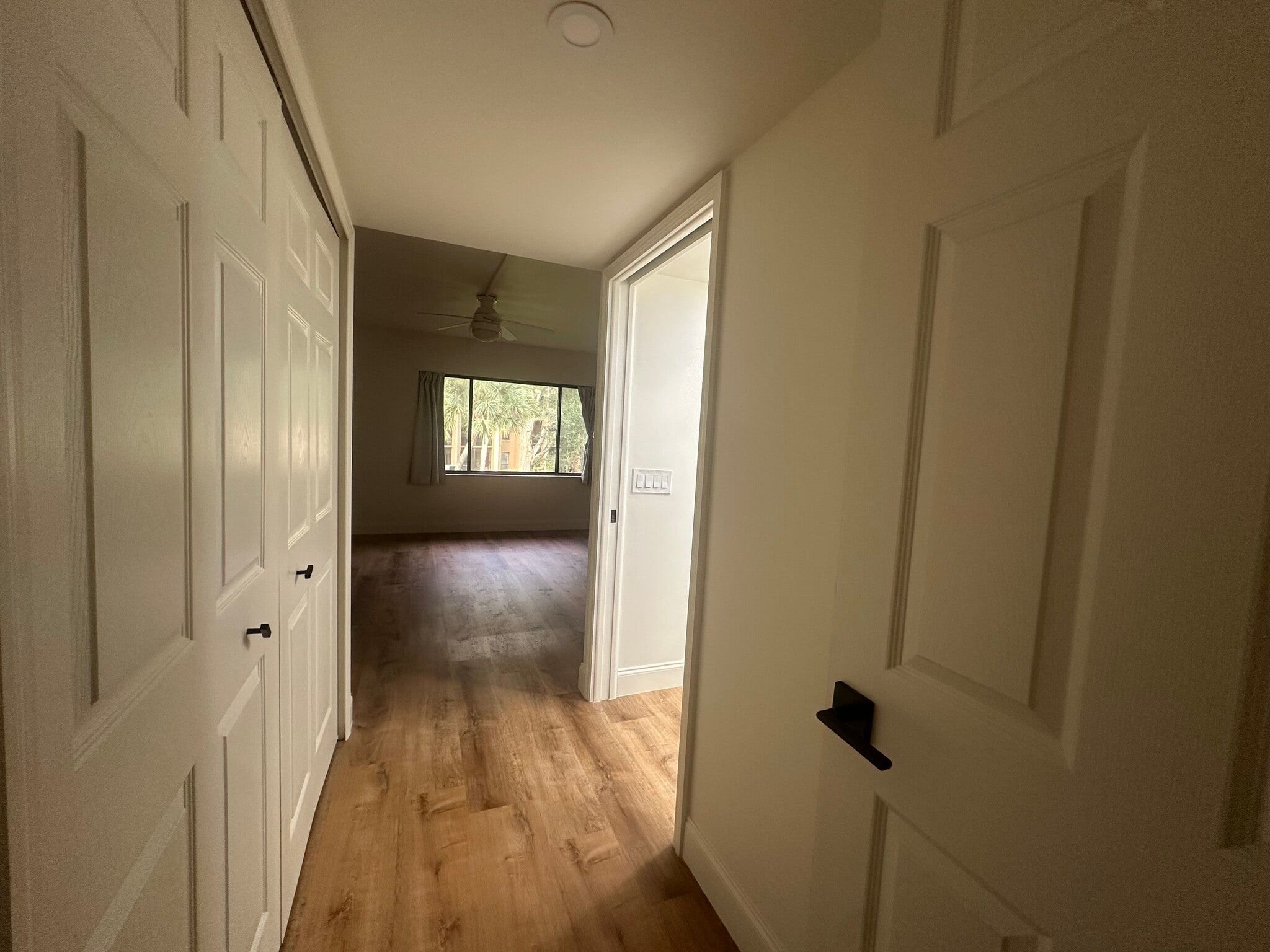 Primary bedroom hallway with bathroom and closet - 630 Cranes Way