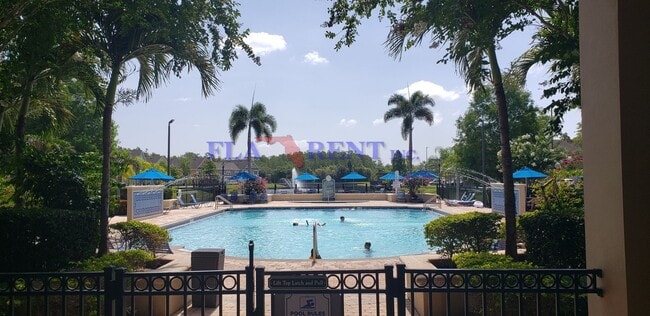 Building Photo - 4 BR / 3 FULL BATH (INCLUDES 2 MASTERS) 2 STORY (NEAR DISNEY!) GATED COMMUNITY WITH COMMUNITY POO...