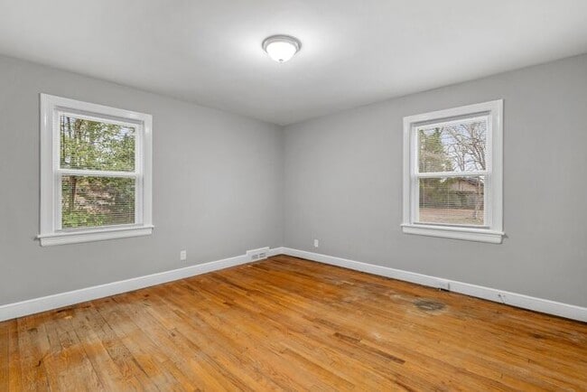 Building Photo - Brick home, Two Story, Hardwoods, DR, 2 Sun Rooms, FP, Carport!.