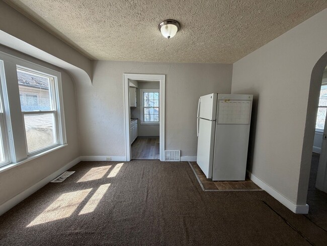 Building Photo - Charming 2-Bedroom Home with Secure Front Porch, Carport & Big Yard in Goodyear Heights